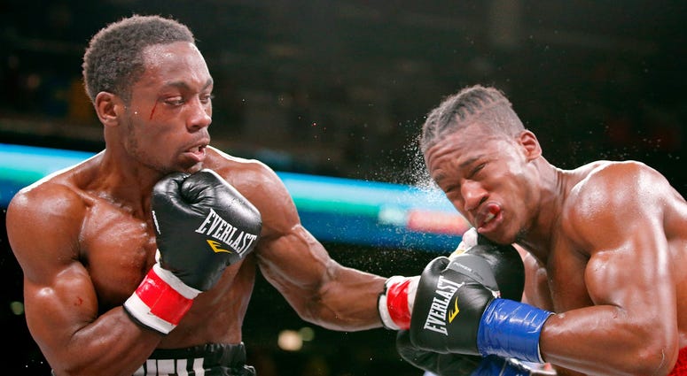 Charles Conwell (black trunks) and Patrick Day (red trunks) box during a USBA Super-Welterweight boxing match at Wintrust Arena. Charles Conwell (black trunks) and Patrick Day (red trunks) box during a USBA Super-Welterweight boxing match at Wintrust Arena.