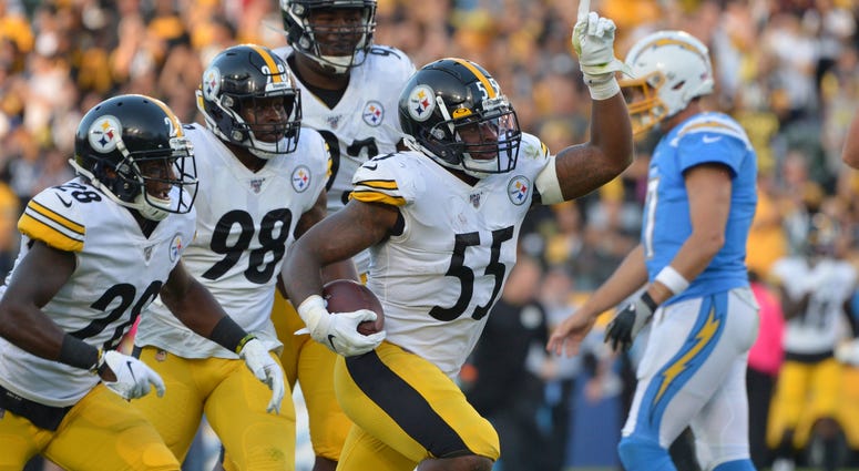 Pittsburgh Steelers linebacker Devin Bush (55) celebrates a first quarter interception with teammates during the first quarter as Los Angeles Chargers quarterback Philip Rivers