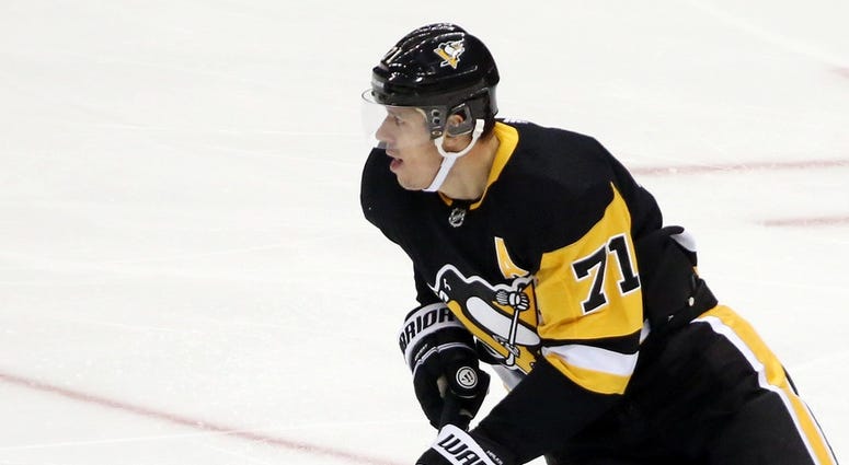 Pittsburgh Penguins center Evgeni Malkin skates with the puck against the Buffalo Sabres Pittsburgh Penguins center Evgeni Malkin skates with the puck against the Buffalo Sabres