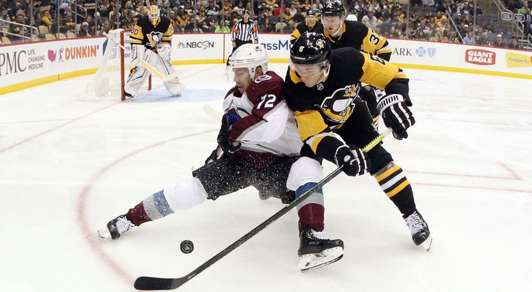Colorado Avalanche right wing Joonas Donskoi is checked off of the puck by Pittsburgh Penguins defenseman John Marino Colorado Avalanche right wing Joonas Donskoi is checked off of the puck by Pittsburgh Penguins defenseman John Marino