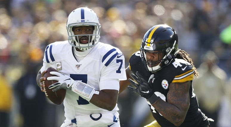 Pittsburgh, PA, USA; Indianapolis Colts quarterback Jacoby Brissett (7) runs with the ball as Pittsburgh Steelers outside linebacker Bud Dupree