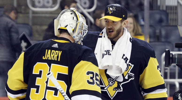 Pittsburgh, PA, USA; Pittsburgh Penguins goaltender Tristan Jarry (35) is congratulated by fellow goaltender Matt Murray