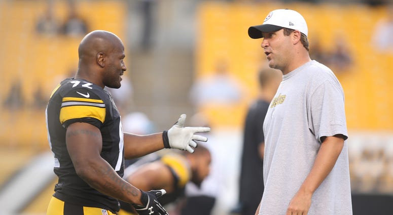 file photo: James Harrison talks to Ben Roethlisberger before a 2015 preseason game