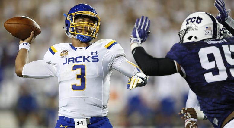 South Dakota State Jackrabbits quarterback Taryn Christion (3) throws under pressure by TCU Horned Frogs defensive tackle Aaron Curry