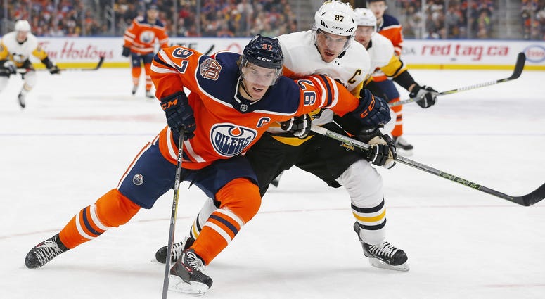 Pittsburgh Penguins forward Sidney Crosby (87) tries to check Edmonton Oilers forward Connor McDavid (97) during the first period at Rogers Place.