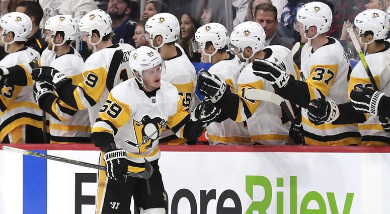 Pittsburgh Penguins center Jake Guentzel (59) celebrates after scoring a goal in the second period against the Winnipeg Jets at Bell MTS Place.