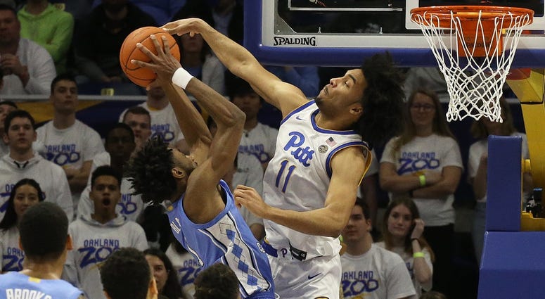 Pittsburgh Panthers guard Justin Champagnie (11) defends North Carolina Tar Heels guard Leaky Black (1) during the second half at the Petersen Events Center. Pittsburgh won 66-52.