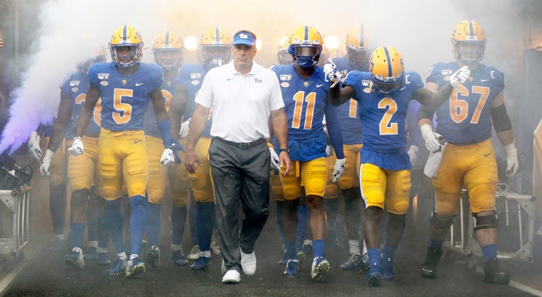 Pittsburgh Panthers head coach Pat Narduzzi (center) leads the team onto the field to play the Ohio Bobcats at Heinz Field. Pittsburgh won 20-10.