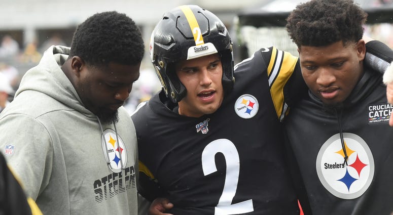 Pittsburgh Steelers quarterback Mason Rudolph (2) is led to a cart during the third quarter against the Baltimore Ravens at Heinz Field. Rudolph left the game with a concussion during the overtime vic...