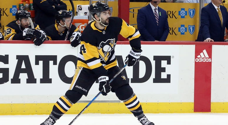Pittsburgh Penguins defenseman Justin Schultz (4) handles the puck against the Washington Capitals during the first period in game six of the second round of the 2018 Stanley Cup Playoffs at PPG PAINT.