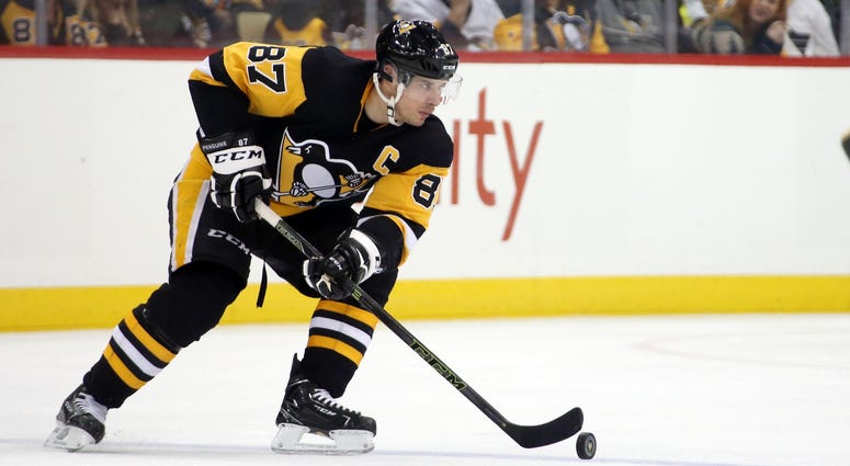Pittsburgh Penguins center Sidney Crosby (87) handles the puck against the Minnesota Wild during the third period at PPG PAINTS Arena. The Penguins won 2-1.