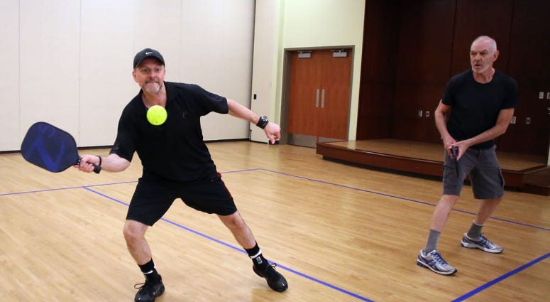 Men playing pickleball
