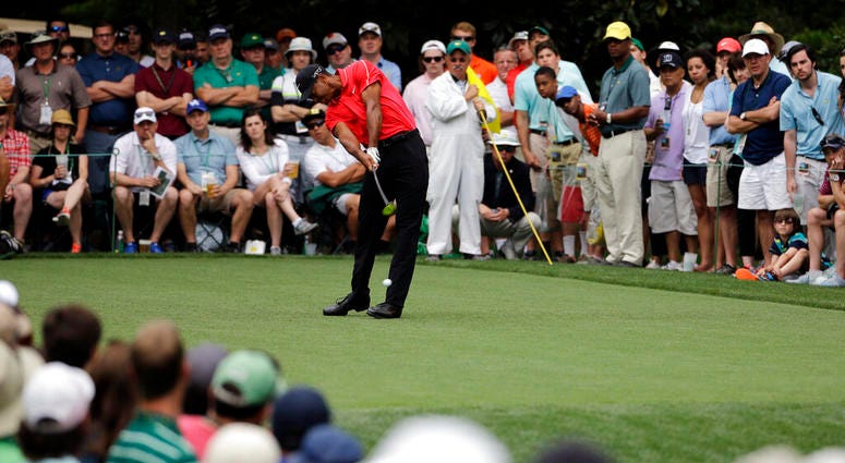 Tiger Woods tees off on the seventh hole during the fourth round of the Masters golf tournament, in Augusta, Ga. Woods goes into the Masters on April 11-14 trying to end 11 years without a major. AP DO NOT USE