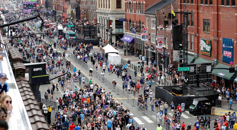 Fans attend the final day of the NFL football draft Saturday, April 27, 2019, in Nashville, Tenn. AP DO NOT USE
