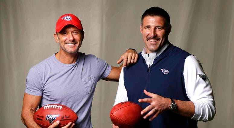 photo, country music star Tim McGraw, left, poses with Tennessee Titans head coach Mike Vrabel in Nashville, Tenn. After the opening round of the NFL Draft in Nashville on Friday, April 25, McGraw will cap off the evening performing on the draft stage AP DO NOT USE