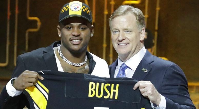 Michigan linebacker Devin Bush poses with NFL Commissioner Roger Goodell after the Pittsburgh Steelers selected Bush in the first round at the NFL football draft, Thursday, April 25, 2019, in Nashville, Tenn. AP DO NOT USE