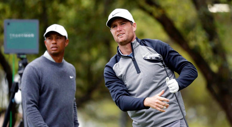 Lucas Bjerregaard, right, watches his drive on the eighth hole as Tiger Woods, left, looks on during quarterfinal play at the Dell Technologies Match Play Championship golf tournament, Saturday, March 30, 2019, in Austin, Texas. Bjerregaard won the match. Lucas Bjerregaard, right, watches his drive on the eighth hole as Tiger Woods, left, looks on during quarterfinal play at the Dell Technologies Match Play Championship golf tournament, Saturday, March 30, 2019, in Austin, Texas. Bjerregaard won the match.