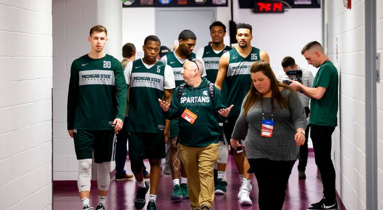 Michigan State guard Matt McQuaid, left, guard Cassius Winston, forward Aaron Henry, forward Xavier Tillman and forward Kenny Goins walk to an NCAA men's college basketball individual news conferences in Washington, Saturday, March 30, 2019. Michigan Stat Michigan State guard Matt McQuaid, left, guard Cassius Winston, forward Aaron Henry, forward Xavier Tillman and forward Kenny Goins walk to an NCAA men's college basketball individual news conferences in Washington, Saturday, March 30, 2019. Michigan Stat