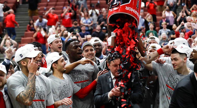 Texas Tech players shower coach Chris Beard with confetti after their win against Gonzaga during the West Regional final in the NCAA men's college basketball tournament Saturday, March 30, 2019, in Anaheim, Calif. Texas Tech won 75-69. Texas Tech players shower coach Chris Beard with confetti after their win against Gonzaga during the West Regional final in the NCAA men's college basketball tournament Saturday, March 30, 2019, in Anaheim, Calif. Texas Tech won 75-69.