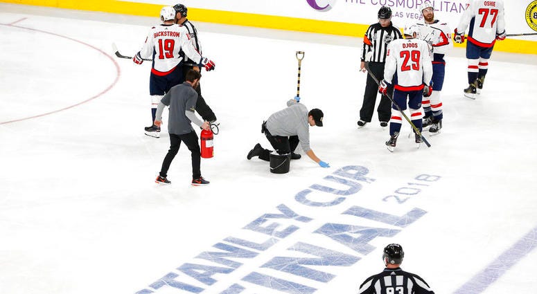 Ice maintenance crew members repair the ice during the third period in Game 1 of the NHL hockey Stanley Cup Finals DO NOT USE