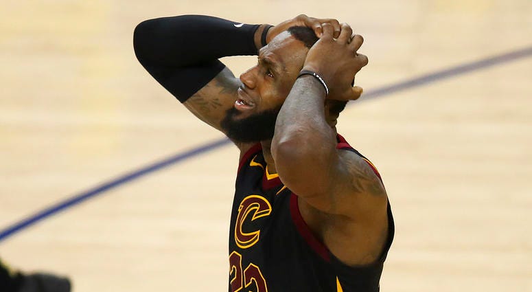 Cleveland Cavaliers forward LeBron James reacts to a call during the second half of Game 1 of basketball's NBA Finals DO NOT USE