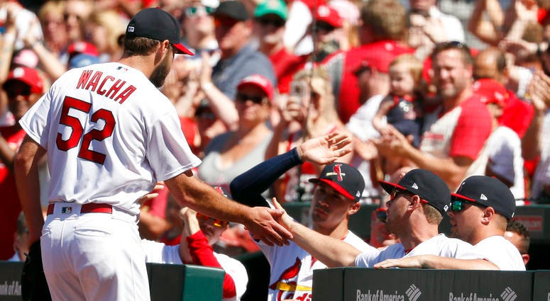 St. Louis Cardinals starting pitcher Michael Wacha is congratulated by teammates after being removed during the ninth inning of a baseball game against the Pittsburgh Pirates DO NOT USE
