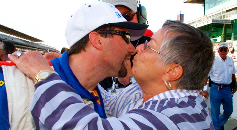 Michael Andretti, of Nazareth, Pa., gets a hug and a kiss from his mother, Dee Ann Andretti, after his qualification run at Indianapolis Motor Speedway in Indianapolis. DO NOT USE