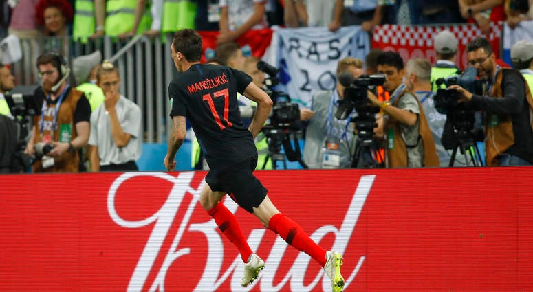 Croatia's Mario Mandzukic celebrates after scoring his side's second goal during the semifinal match between Croatia and England at the 2018 soccer World Cup DO NOT USE