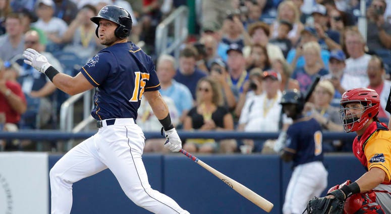 Tim Tebow watches his double off Western Division's Beau Burrows during the second inning of the Eastern League All-Star minor league baseball game, in Trenton, N.J. Mets minor leaguer Tim Tebow is set for hand surgery Tuesday, July 24, 2018, and likely d DO NOT USE