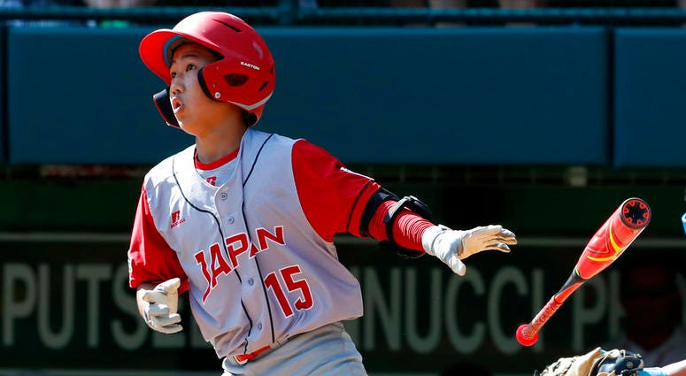 apan's Masaumi Ikeuchi doubles off Puerto Rico pitcher John Lopez in the third inning of an elimination baseball game in International pool play at the Little League World Series tournament in South Williamsport, Pa DO NOT USE