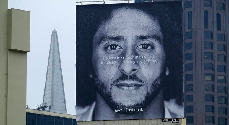 A large billboard stands on top of a Nike store showing former San Francisco 49ers quarterback Colin Kaepernick at Union Square, DO NOT USE