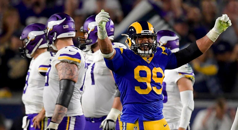 Los Angeles Rams defensive tackle Aaron Donald celebrates after sacking Minnesota Vikings quarterback Kirk Cousins DO NOT USE