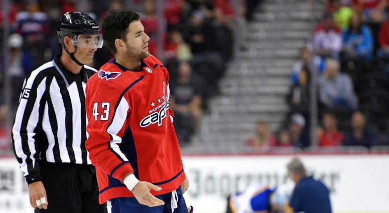 file photo, Washington Capitals right wing Tom Wilson (43) is escorted by an official off the ice after he checked St. Louis Blues center Oskar Sundqvist, DO NOT USE
