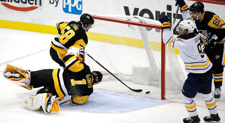 Buffalo Sabres' Jack Eichel (9) celebrates his game-winning overtime goal past Pittsburgh Penguins goaltender Casey DeSmith Buffalo Sabres' Jack Eichel (9) celebrates his game-winning overtime goal past Pittsburgh Penguins goaltender Casey DeSmith