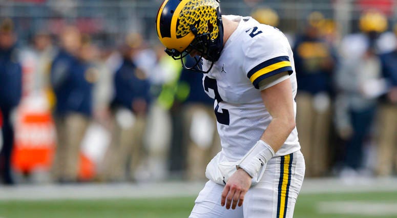 Michigan quarterback Shea Patterson reacts to throwing an incomplete pass against Ohio State Michigan quarterback Shea Patterson reacts to throwing an incomplete pass against Ohio State