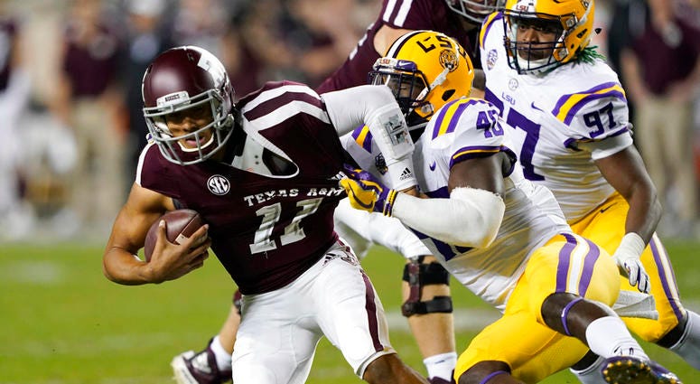 Texas A&M quarterback Kellen Mond (11) is sacked by LSU linebacker Devin White Texas A&M quarterback Kellen Mond (11) is sacked by LSU linebacker Devin White