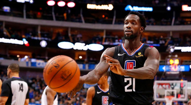 Los Angeles Clippers guard Patrick Beverley (21) throws a ball at a fan during the second half of an NBA basketball game against the Dallas Maverick Los Angeles Clippers guard Patrick Beverley (21) throws a ball at a fan during the second half of an NBA basketball game against the Dallas Maverick