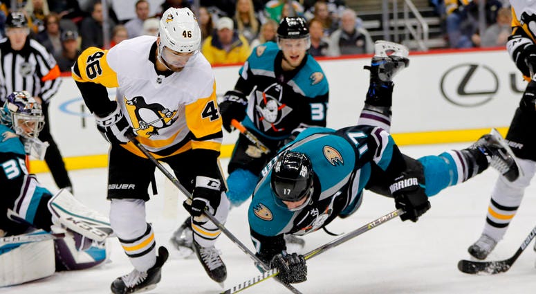 Anaheim Ducks' Ryan Kesler (17) tumbles as he and Pittsburgh Penguins' Zach Aston-Reese Anaheim Ducks' Ryan Kesler (17) tumbles as he and Pittsburgh Penguins' Zach Aston-Reese