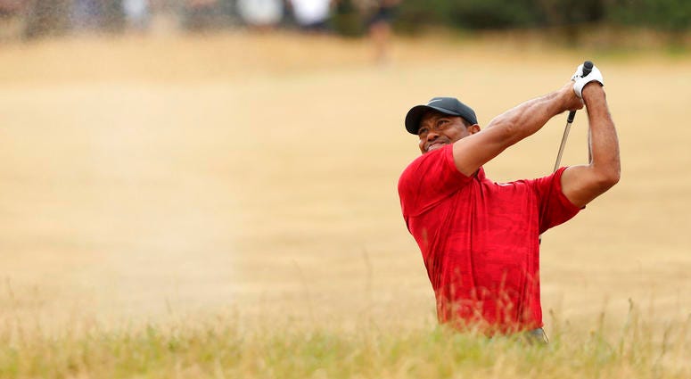 Tiger Woods of the U.S. plays out of a bunker on the 10th hole during the final round for the 147th British Open Golf championships in Carnoustie, Scotland Tiger Woods of the U.S. plays out of a bunker on the 10th hole during the final round for the 147th British Open Golf championships in Carnoustie, Scotland