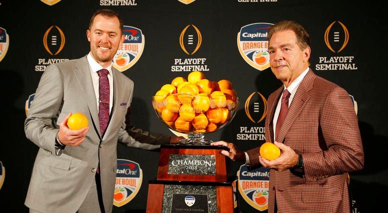 Alabama head coach Nick Saban, right, stands with Oklahoma head coach Lincoln Riley Alabama head coach Nick Saban, right, stands with Oklahoma head coach Lincoln Riley
