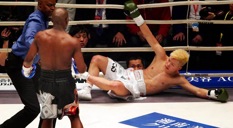 Japanese kickboxer Tenshin Nasukawa lies on the mat after being knocked out by Floyd Mayweather Jr. during first round of their three-round exhibition match on New Year's Eve DO NOT USE