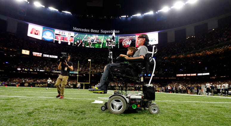 former New Orleans Saints player Steve Gleason rides onto the field with with his son Rivers before an NFL football game against the Atlanta Falcons in New Orleans former New Orleans Saints player Steve Gleason rides onto the field with with his son Rivers before an NFL football game against the Atlanta Falcons in New Orleans