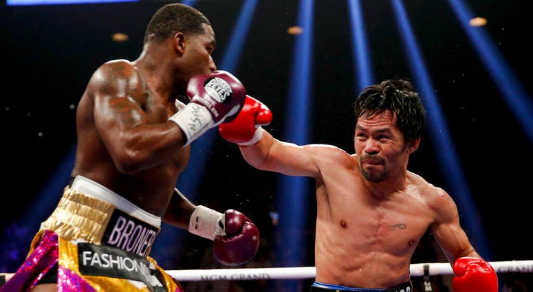 Manny Pacquiao, right, throws a right to Adrien Broner in the WBA welterweight title boxing match Saturday, Jan. 19, 2019, in Las Vegas Manny Pacquiao, right, throws a right to Adrien Broner in the WBA welterweight title boxing match Saturday, Jan. 19, 2019, in Las Vegas