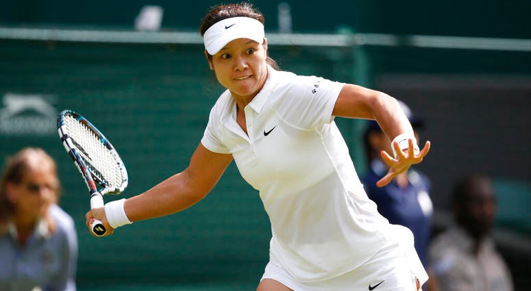 Li Na of China plays a return to Paula Kania of Poland during their first round match at the All England Lawn Tennis Championships in Wimbledon, London Li Na of China plays a return to Paula Kania of Poland during their first round match at the All England Lawn Tennis Championships in Wimbledon, London