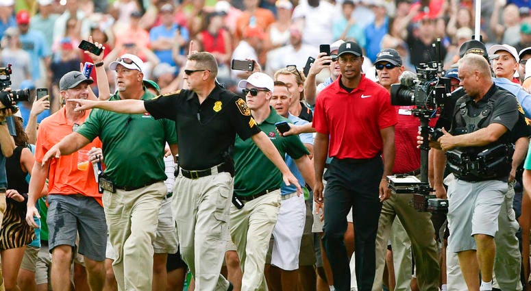 Tiger Woods making his way down the 18th fairway during the final round of the Tour Championship golf tournament in Atlanta. AP DO NOT USE