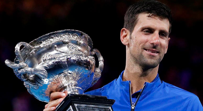 Serbia's Novak Djokovic holds his trophy after defeating Spain's Rafael Nadal in the men's singles final at the Australian Open tennis championships Serbia's Novak Djokovic holds his trophy after defeating Spain's Rafael Nadal in the men's singles final at the Australian Open tennis championships