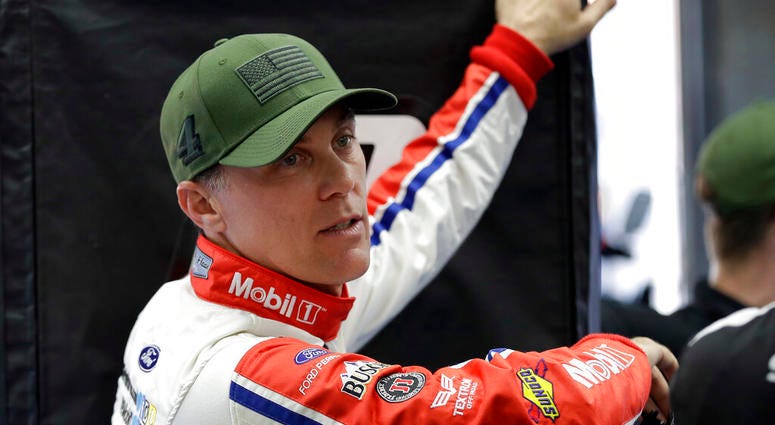 Kevin Harvick waits for his car to go through inspection before qualifying for the NASCAR Cup series auto race at Charlotte Motor Speedway in Charlotte, N.C. Kevin Harvick waits for his car to go through inspection before qualifying for the NASCAR Cup series auto race at Charlotte Motor Speedway in Charlotte, N.C.