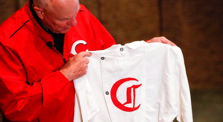 Greg Rhodes, the Cincinnati Reds baseball team historian, holds a replica jersey of the early Cincinnati Red Stockings team at Cincinnati Reds Hall of Fame AP DO NOT USE