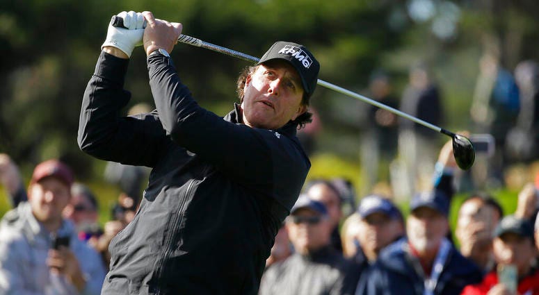 Phil Mickelson follows his drive from the fourth tee of the Pebble Beach Golf Links during the final round of the AT&T Pebble Beach Pro-Am golf tournament AP DO NOT USE
