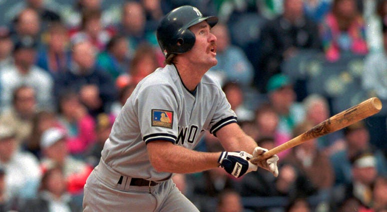 New York Yankees' wears Major League Baseball's 100th anniversary patch as he follows the flight of his ninth inning two-RBI double against the Milwaukee Brewers, in Milwaukee. AP DO NOT USE